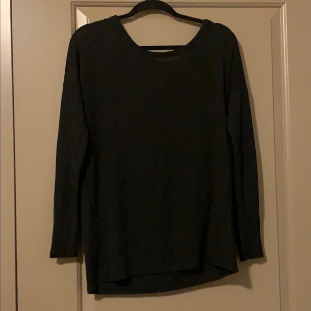 Black tie detail on the back. Long sleeve top